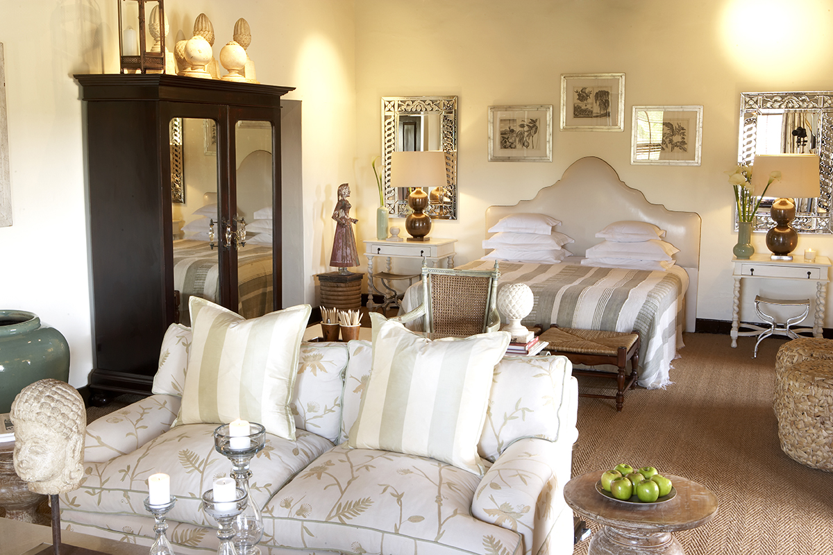 7. Bushmans Kloof Deluxe Room bed and seating area